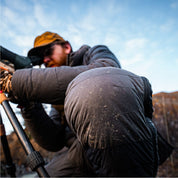 Frost on the knee of the STATIC down pant as a hunter glasses through a spotting scope