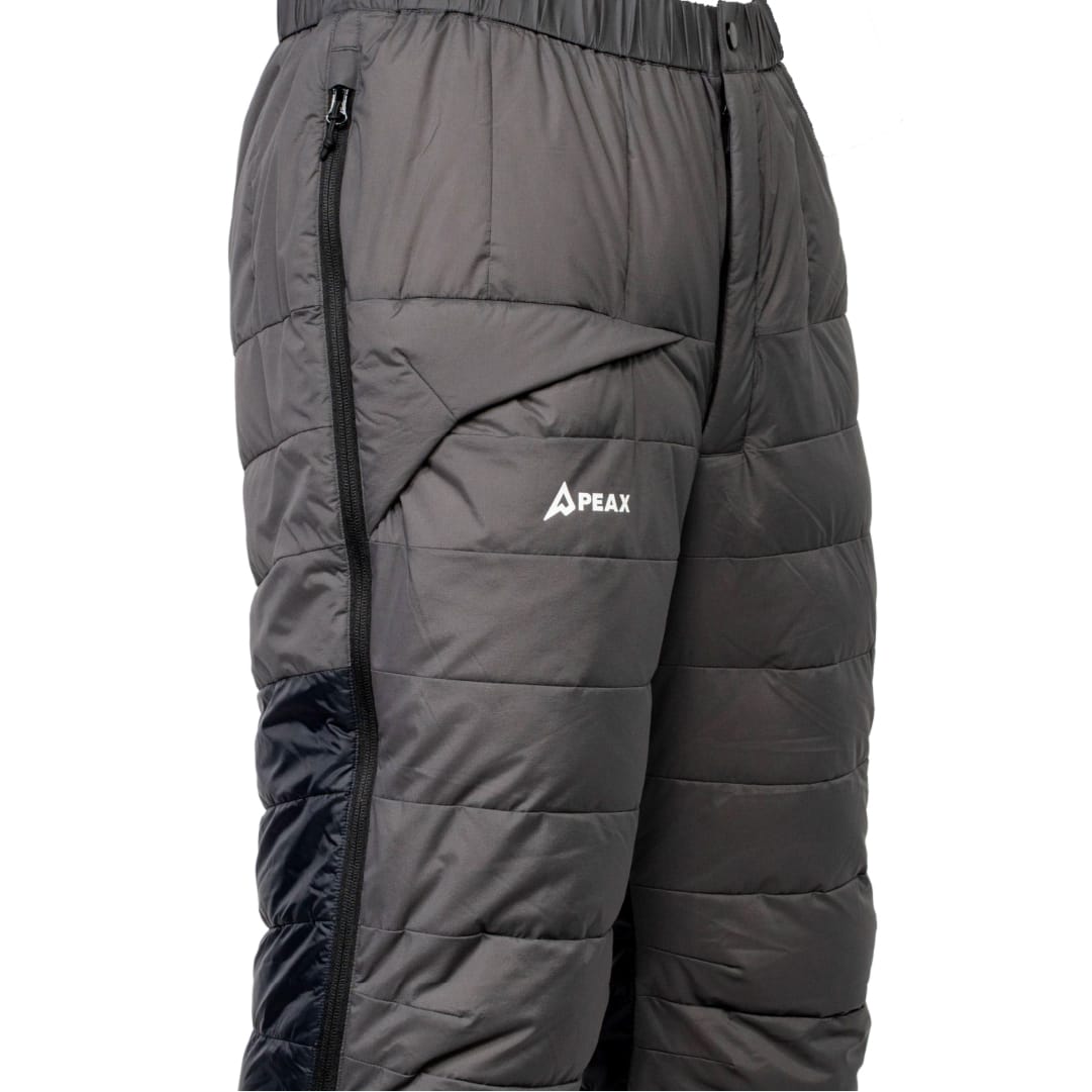 Side view of the darker reinforced panels on the lower leg of the pant