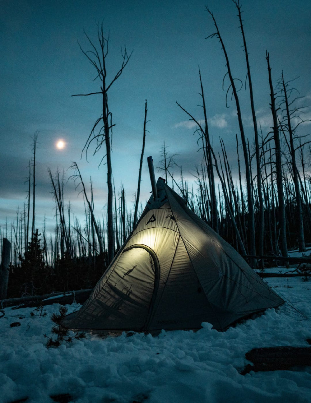 Solitude 4 Tipi Hot Tent with the Torrid backcountry titanium stove on a cold and snowy spring morning.