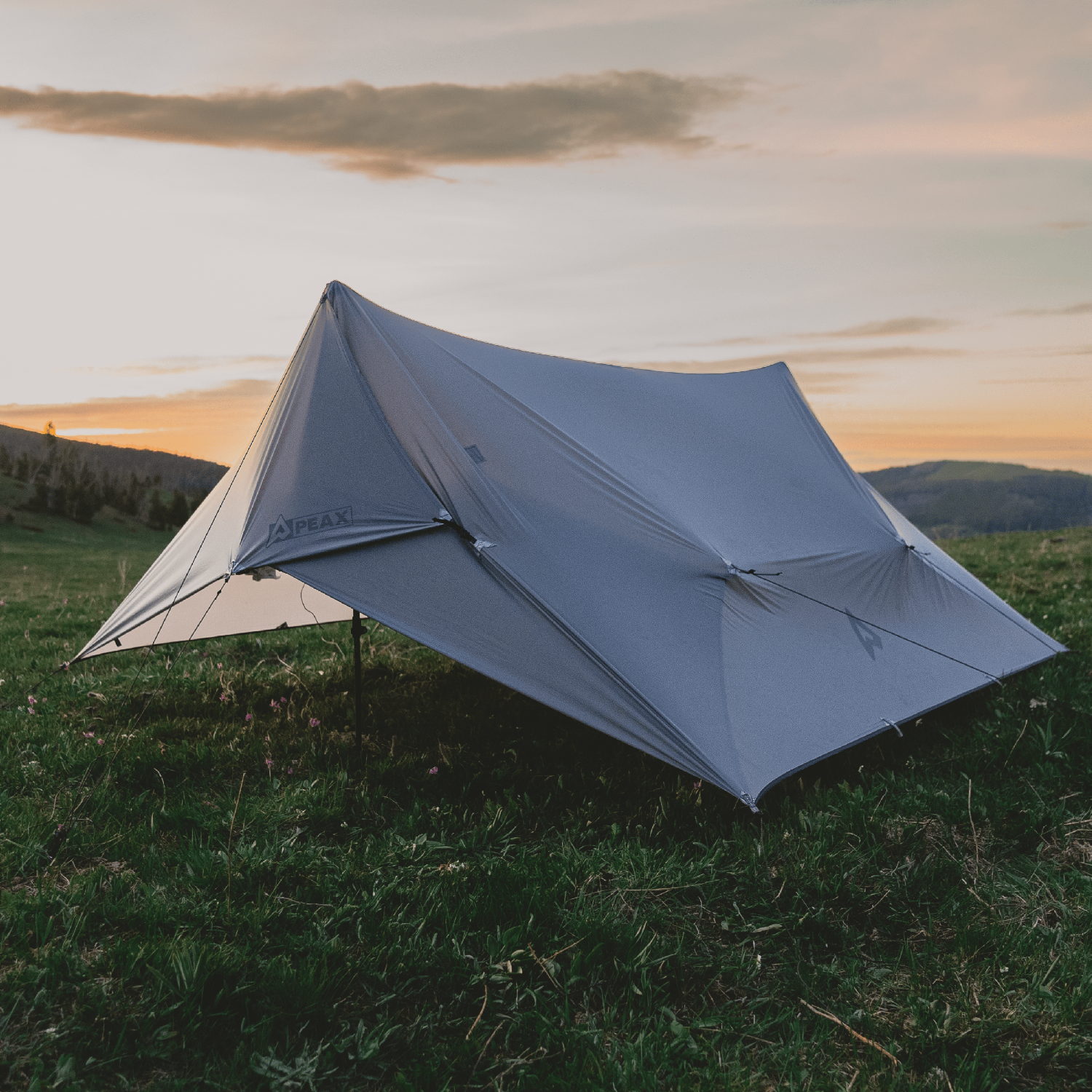 Origami TNT tent and tarp setup on mountain ridge